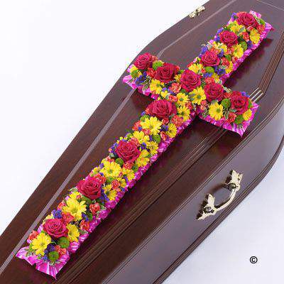 <h2>Large Vibrant Classic Cross-Shaped Design | Funeral Flowers</h2>
<br>
<ul>
<li>Approximate Size W 45cm H 130cm</li>
<li>Hand created large vibrant classic cross in fresh flowers</li>
<li>To give you the best we may occasionally need to make substitutes</li>
<li>Funeral Flowers will be delivered at least 2 hours before the funeral</li>
<li>For delivery area coverage see below</li>
</ul>
<br>
<h2>Liverpool Flower Delivery</h2>
<br>
<p>We have a wide selection of Funeral Crosses offered for Liverpool Flower Delivery. Funeral Crosses can be provided for you in Liverpool, Merseyside and we can organize Funeral flower deliveries for you nationwide. Funeral Flowers can be delivered to the Funeral directors or a house address. They can not be delivered to the crematorium or the church.</p>
<br>
<h2>Flower Delivery Coverage</h2>
<br>
<p>Our shop delivers funeral flowers to the following Liverpool postcodes L1 L2 L3 L4 L5 L6 L7 L8 L11 L12 L13 L14 L15 L16 L17 L18 L19 L24 L25 L26 L27 L36 L70 If your order is for an area outside of these we can organise delivery for you through our network of florists. We will ask them to make as close as possible to the image but because of the difference in stock and sundry items it may not be exact.</p>
<br>
<h2>Liverpool Funeral Flowers | Crosses</h2>
<br>
<p>This large classic funeral cross has been loving handcrafted by our expert florists and features a vibrant mix of spray chrysanthemums, roses, spray carnations and luscious green foliage to complete this traditional design.</p>
<br>
<p>Funeral crosses are symbols of belief they reaffirm faith and provide comfort at this difficult time.</p>
<br>
<p>In the larger sizes (from 4ft up) they are appropriate as the main tribute but smaller sizes are sometimes chosen by close friends as they represent extremely personal sentiments and feelings.</p>
<br>
<p>Containing 5 yellow spray chrysanthemums, 5 green spray chrysanthemums, 12 cerise short-stem roses, 15 orange spray carnations, 6 blue statice and seasonal mixed foliage.</p>
<br>
<h2>Best Florist in Liverpool</h2>
<p>Trust Award-winning Liverpool Florist, Booker Flowers and Gifts, to deliver funeral flowers fitting for the occasion delivered in Liverpool, Merseyside and beyond. Our funeral flowers are handcrafted by our team of professional fully qualified who not only lovingly hand make our designs but hand-deliver them, ensuring all our customers are delighted with their flowers. Booker Flowers and Gifts your local Liverpool Flower shop.</p>
<br>
<p><em>Janice Crane - 5 Star Review on Google - Funeral Florist Liverpool</em></p>
<br>
<p><em>I recently had to order a floral tribute for my sister in laws funeral and the Booker Flowers team created a beautifully stunning arrangement. Thank you all so much, Janice Crane.</em></p>